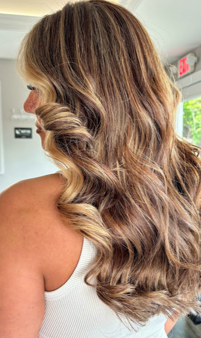 Glossy balayage hair styled at Salon TG